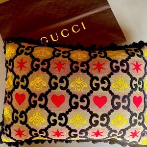 Gucci Bee and Heart cushion featured in the Gucci cafe